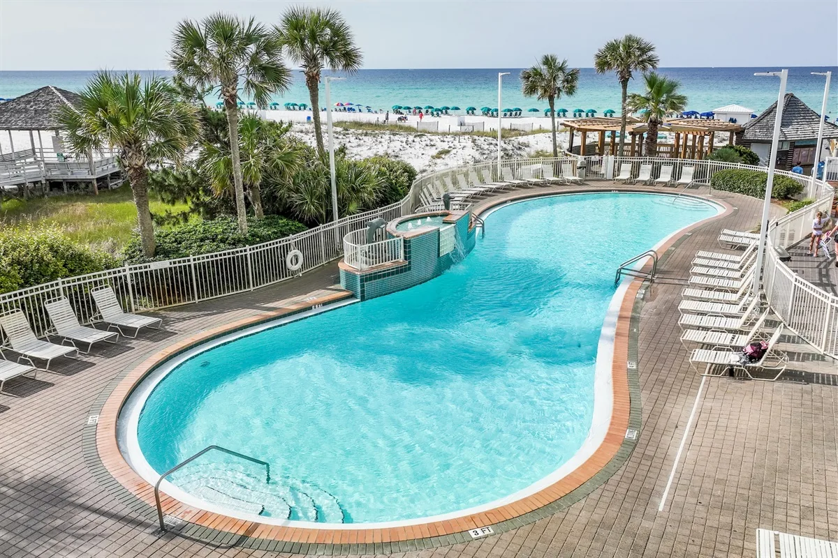 White-sand beach and Gulf water at Pelican Beach Resort in Destin
